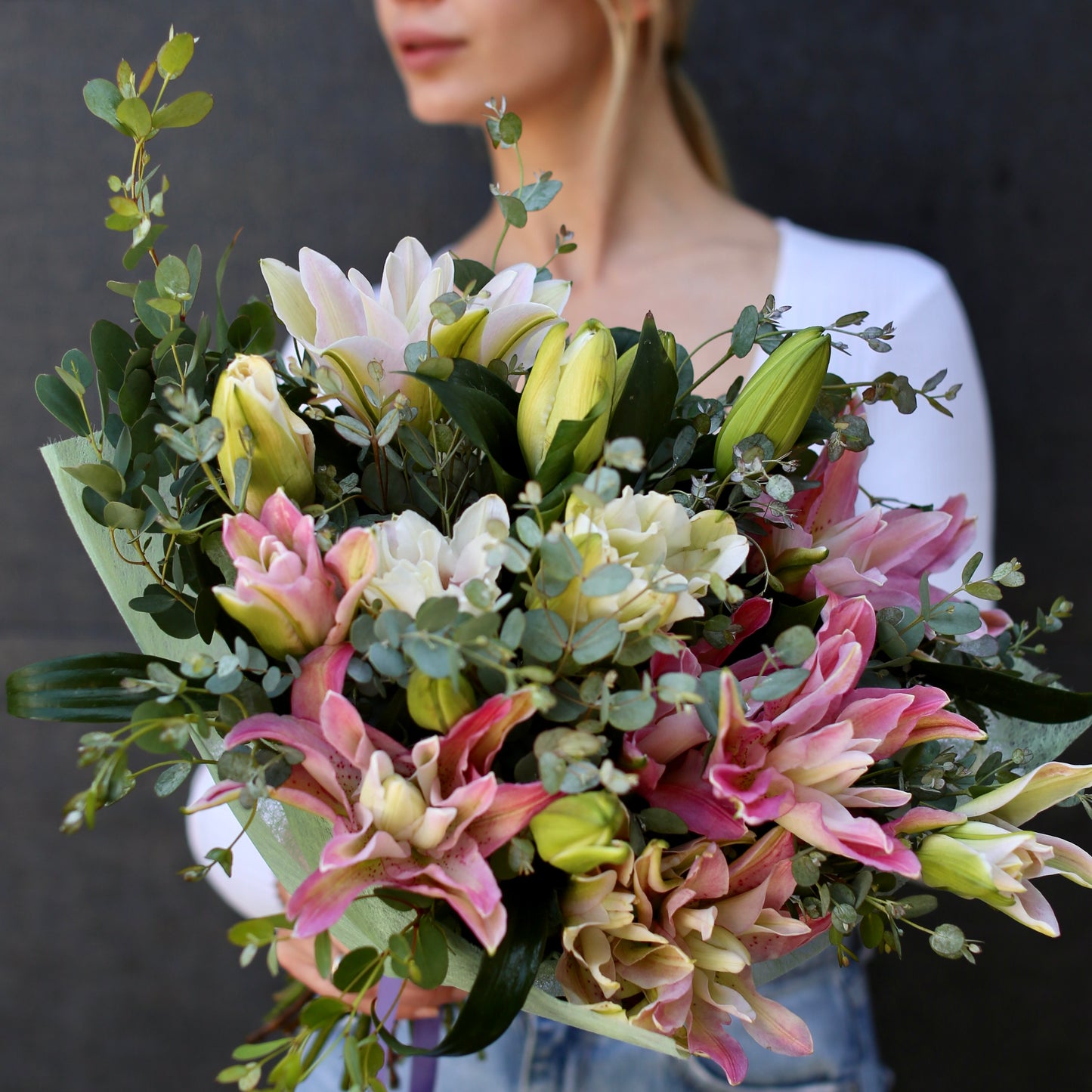 
                  
                    Bouquet with lilies and eucalyptus
                  
                